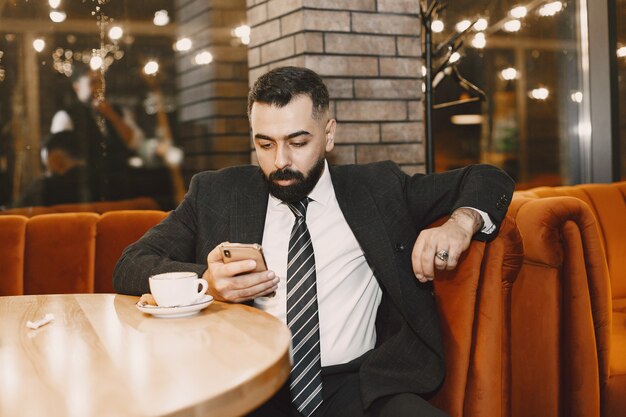 Businessman posing in a cafe