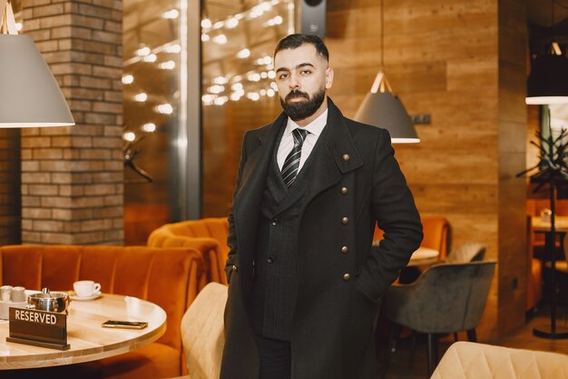 Businessman posing in a restaurant