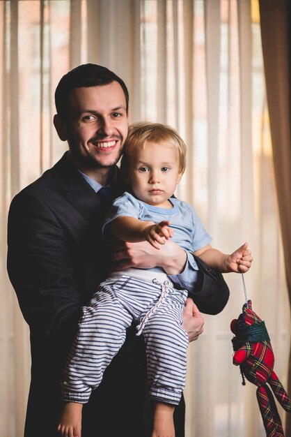 Businessman posing with his son