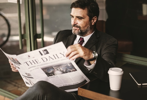 Businessman reading the daily news