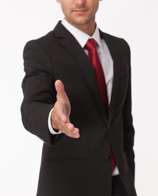 Businessman ready for handshake on white