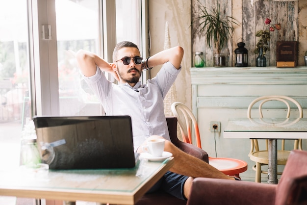 Businessman resting at laptop