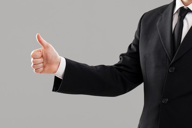 Businessman's torso with thumb up