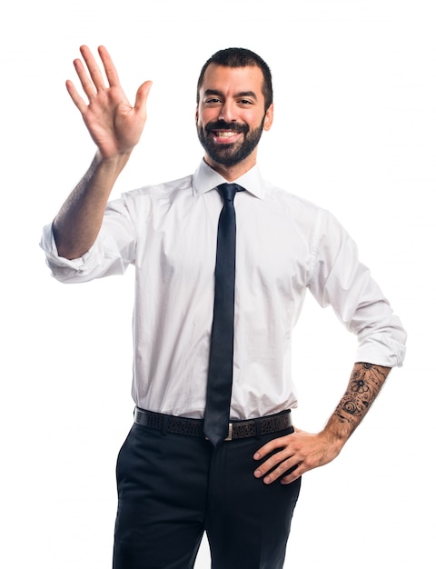 Businessman saluting