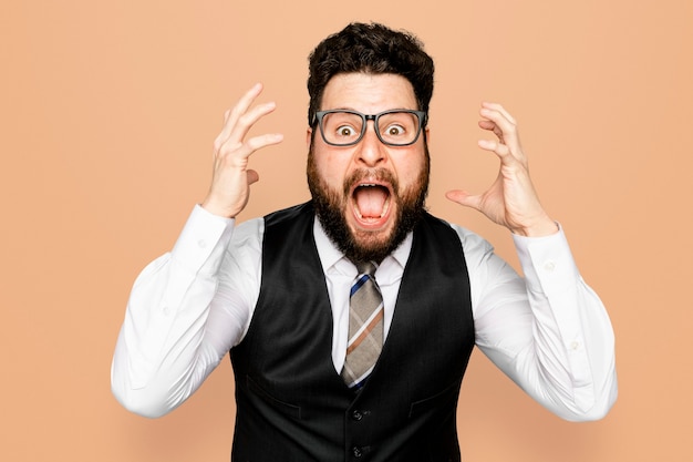 Free photo businessman screaming shocked facial expression