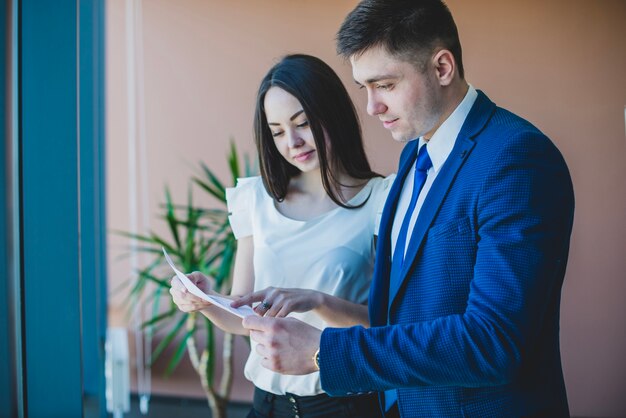Businessman and secretary with document