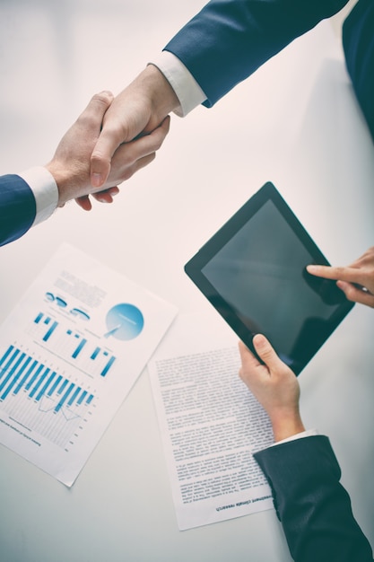 Businessman shaking hands with client