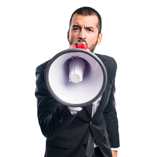 Businessman shouting by megaphone