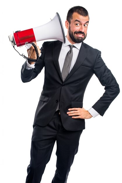 Businessman shouting by megaphone