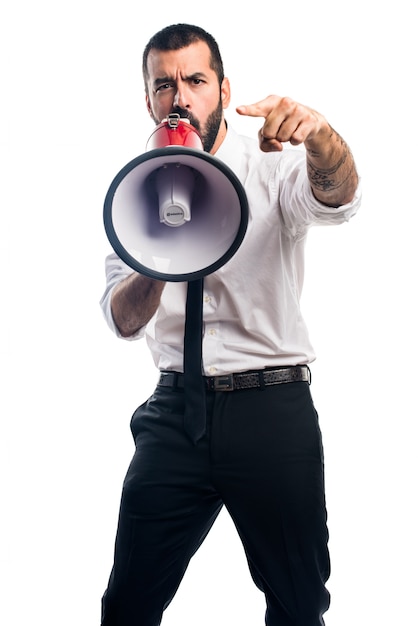 Businessman shouting by megaphone