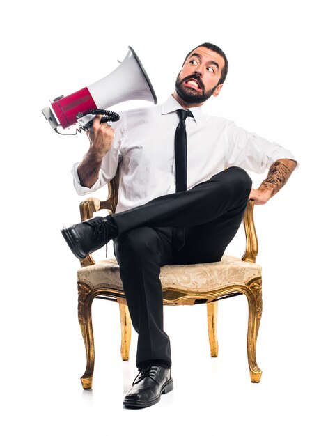 Businessman shouting by megaphone