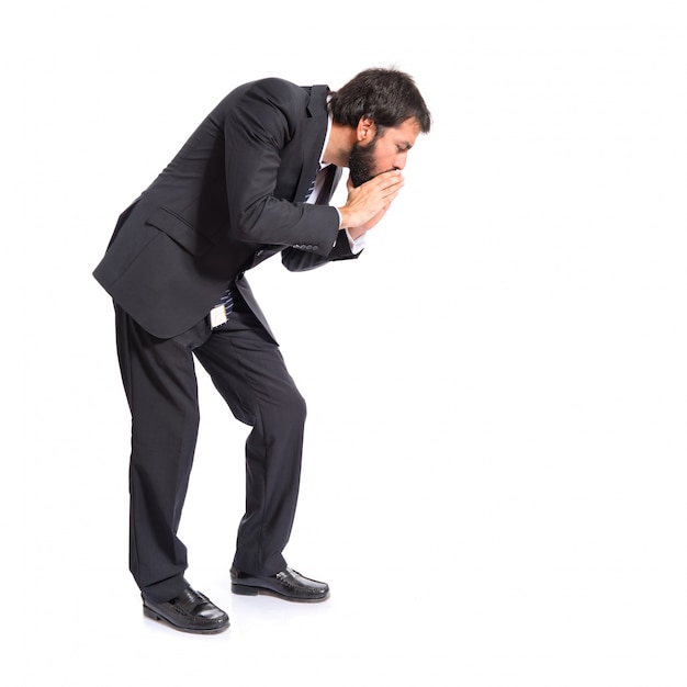 Businessman shouting down over isolated white background