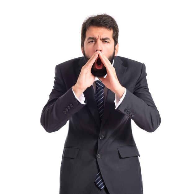 Businessman shouting over isolated white background