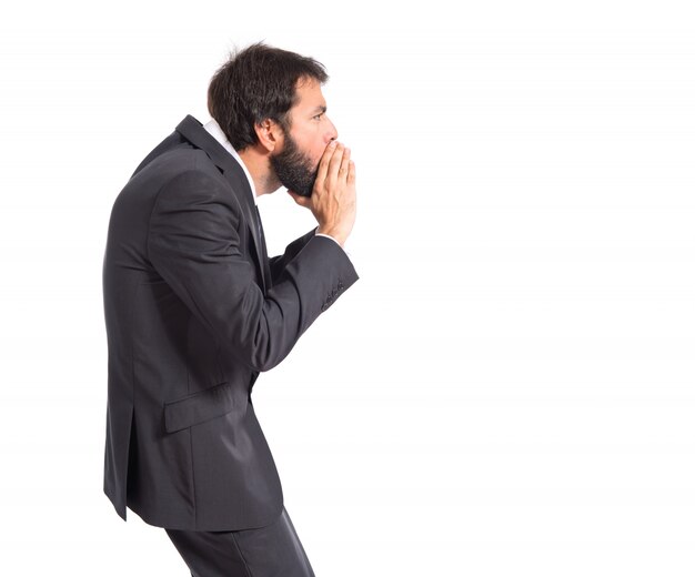 Businessman shouting over isolated white background