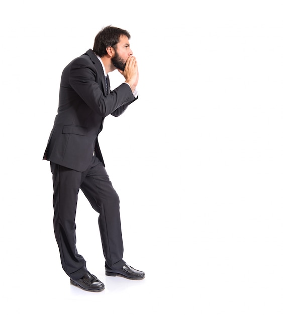 Businessman shouting over isolated white background