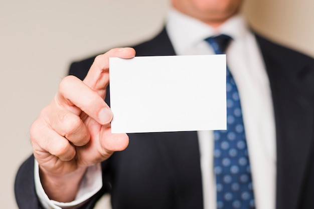 Businessman showing card