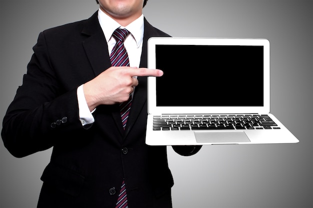 Businessman showing laptop