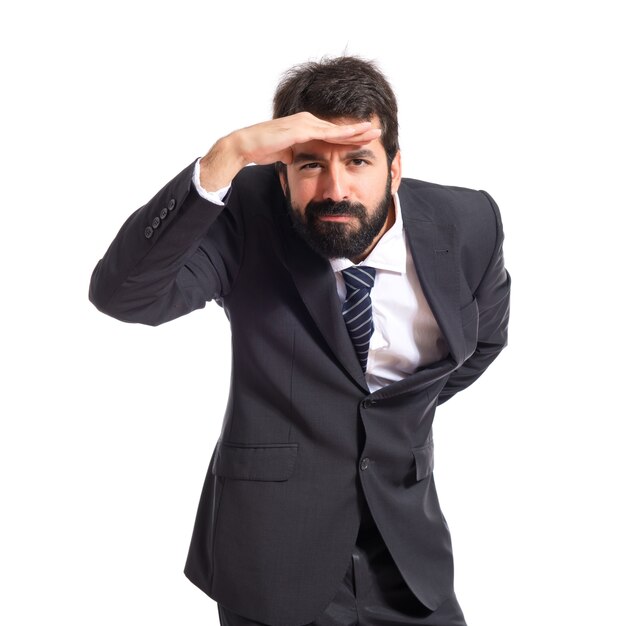 Businessman showing something over white background