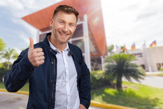 Businessman showing thumbs up sign