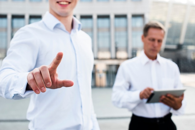 Businessman showing two gesture