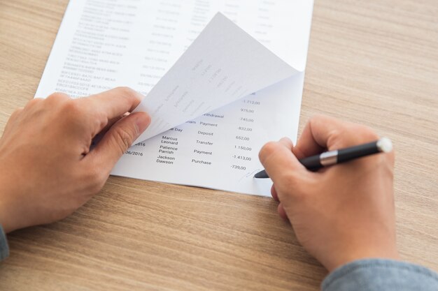 Businessman signing accounting documents