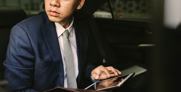 Free photo businessman sitting in the car