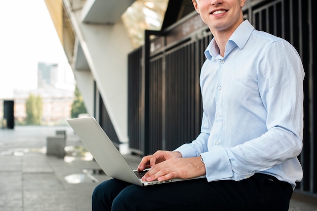 Businessman sitting with laptop