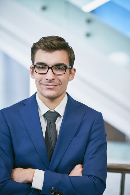 Businessman smiling with arms crossed