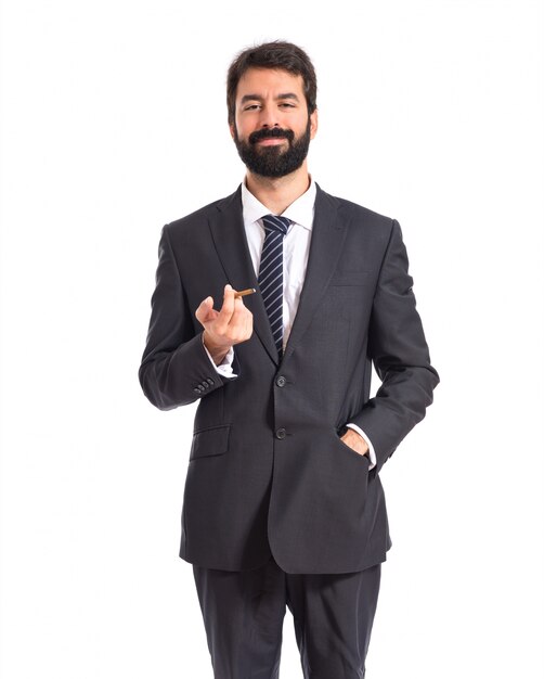 Businessman smoking over isolated white background