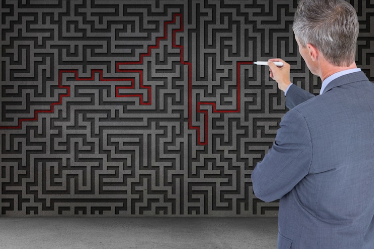 Free Photo businessman solving a maze