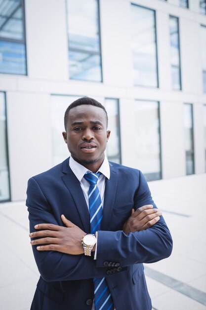 Businessman standing outside office building