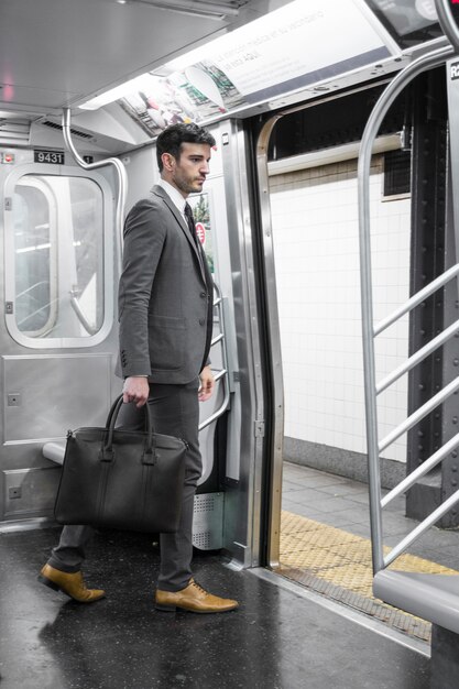 Businessman in subway car