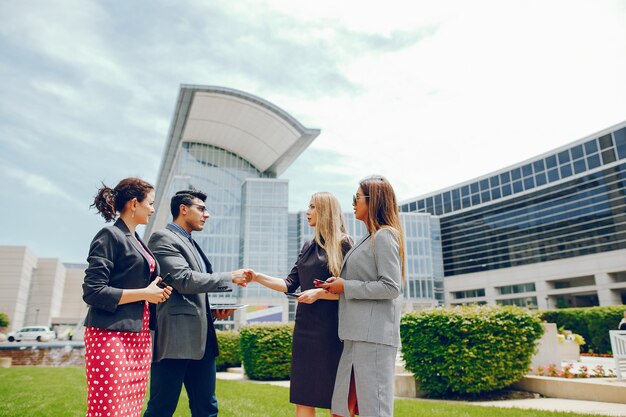 businessman in a summer city with three women