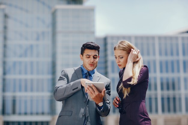 businessman in a summer city with woman