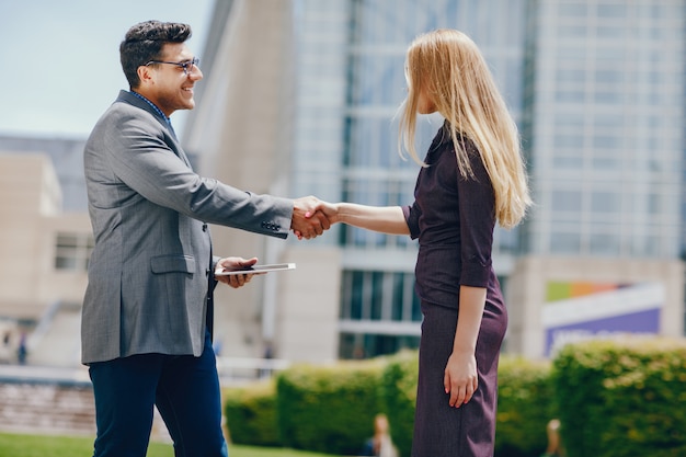 businessman in a summer city with woman