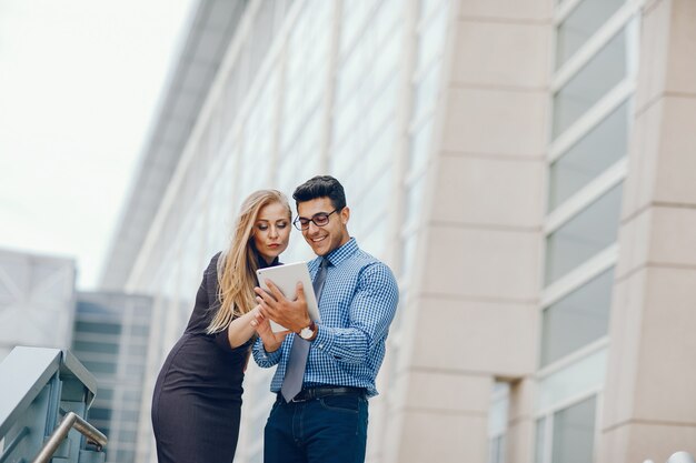 businessman in a summer city with woman