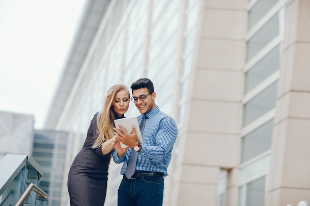 businessman in a summer city with woman