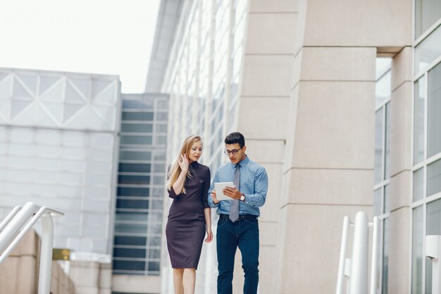 businessman in a summer city with woman