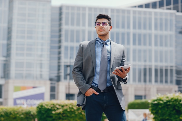 Free photo businessman in a summer city