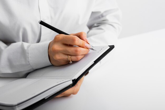 Businessman taking notes into a notebook