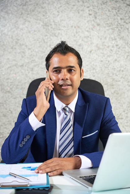 Free photo businessman talking on the phone