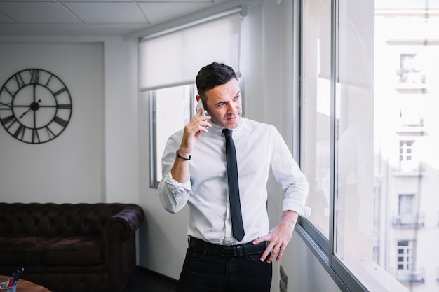 Businessman talking on smartphone