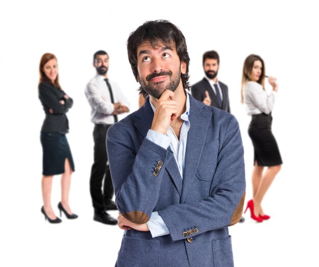 Businessman thinking over isolated white background