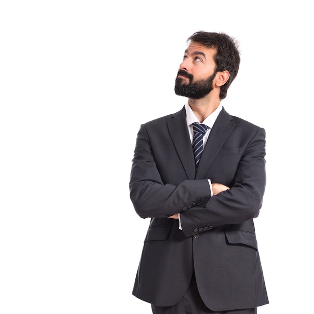 Businessman thinking over isolated white background