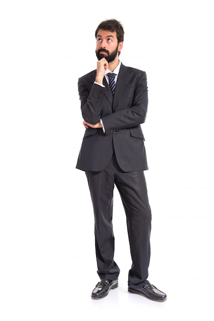 Businessman thinking over isolated white background