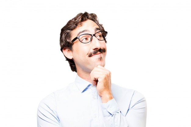 Businessman touching his chin and looking up