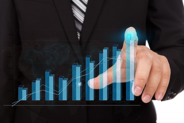 Businessman touching the tip of a bar chart