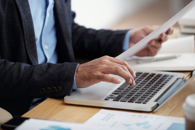 Businessman typing on keyboard