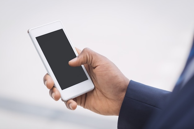 Businessman using mobile phone