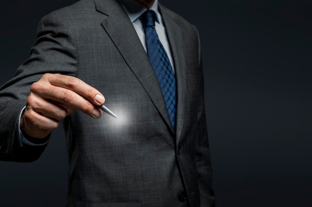 Businessman using a pen and signing on an invisible screen